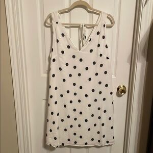 Chic White and Black Polka Dot dress with V-Neck.